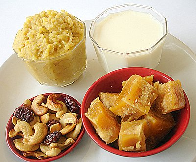 Cooked moong dal, milk, jaggery, fried cashewnuts and kismis